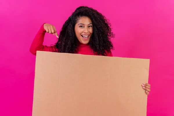 Curly Haired Woman Pointing Sign Pink Background Studio Shot — Fotografia de Stock