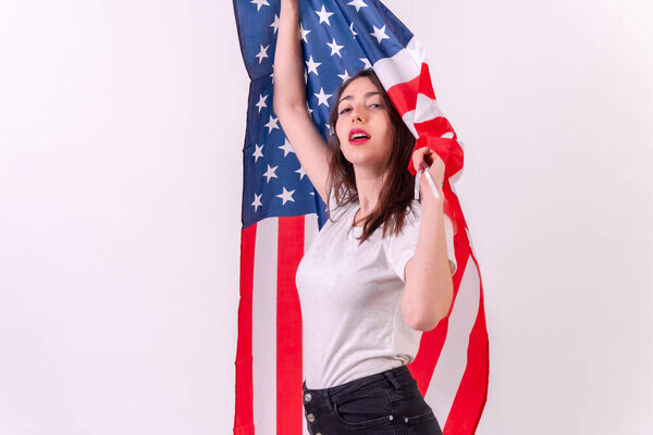 caucasian woman with usa flag isolated on a white background