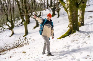 Portrait of a hiker on a snow trekking, winter adventures, natural activity