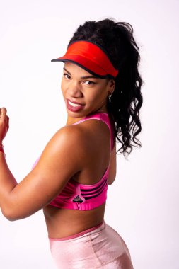 Zumba class, portrait of black ethnic woman in a workout on a white background smiling