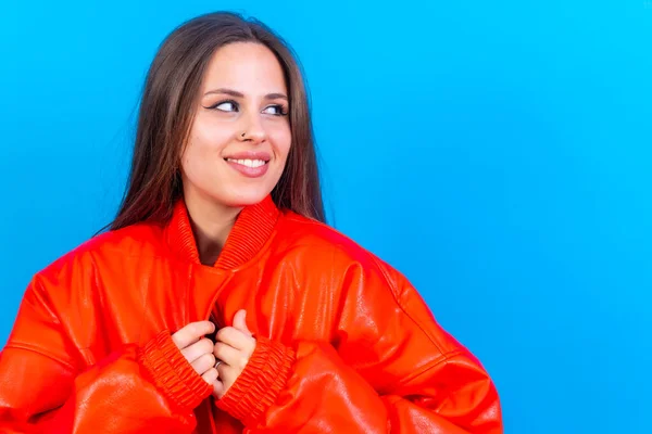 Close Portrait Young Caucasian Woman Red Windbreaker Isolated Blue Background — стоковое фото