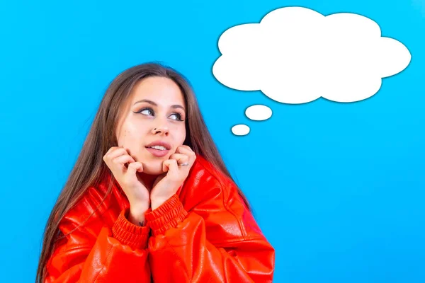 Thinking woman with many ideas with empty bubble on blue background, gesture of thinking or imagine