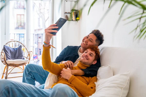 Beautiful Gay Couple Being Romantic Home Sofa Taking Selfie Lgbt — Stock Photo, Image