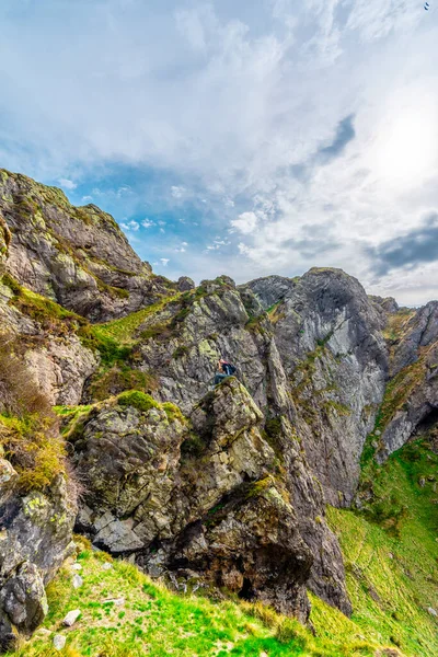 stock image Mountain of Aiako Harria or Penas de Aya in the municipality of Oiatzun, Basque Country. man sitting on top