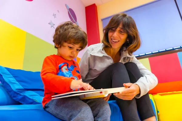Woman Teacher Playing Child Sitting Reading Book Having Fun Interior — Stock Photo, Image