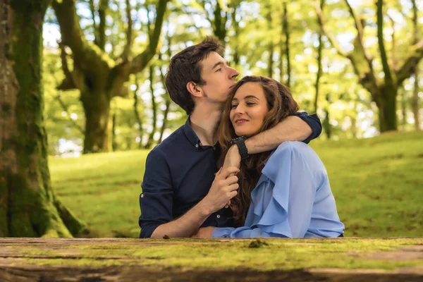 stock image Frontal horizontal photo of tender scene of lovers embracing in a forest