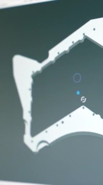 Mühendisler, modern bir fabrikanın bilgisayarında metal bir parça tasarlıyorlar.