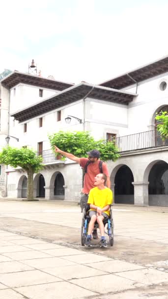 Disabled Person Wheelchair Walking Town Square Friend — Vídeo de Stock