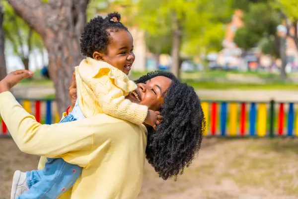 Joyful Mother Adorable African Girl Embracing Playing Park — Stock Photo, Image