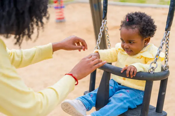 Close Happy Little African Girl Swinging Her Mother Park Stok Gambar Bebas Royalti