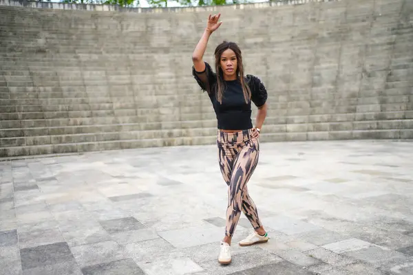 stock image Full length photo of a latin woman having fun dancing cuban salsa in a park alone