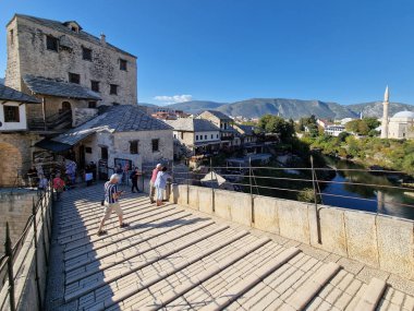 Mostar - iconic old town with famous bridge in Bosnia and Herzegovina. popular tourist destination clipart