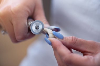 Dental technician works by brush with jaw model. Facial Dental Prosthetic