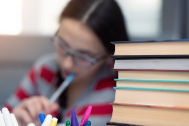 Young female Student doing complicated homework online