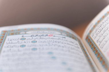 Sarajevo, Bosnia and Herzegovina, 20th february 2023; Muslim beads and Koran or Qoran on wooden table. Islamic religion concept.
