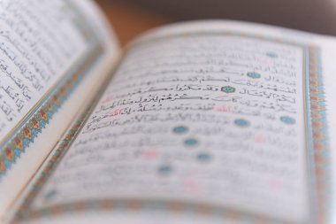 Sarajevo, Bosnia and Herzegovina, 20th february 2023; Muslim beads and Koran or Qoran on wooden table. Islamic religion concept.