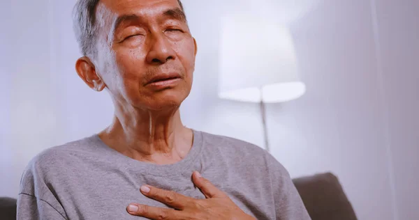 Asian Old Man Having Difficulty Breathing While Sitting Sofa Home — Stock Photo, Image