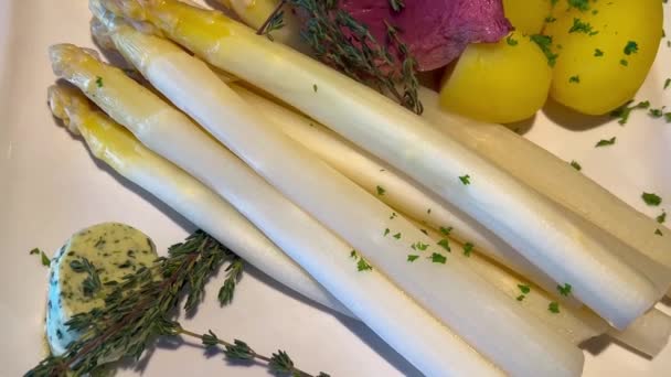 Steaming Medium Rare Steak Plate White Asparagus Sprouts New Potatoes — Stock Video