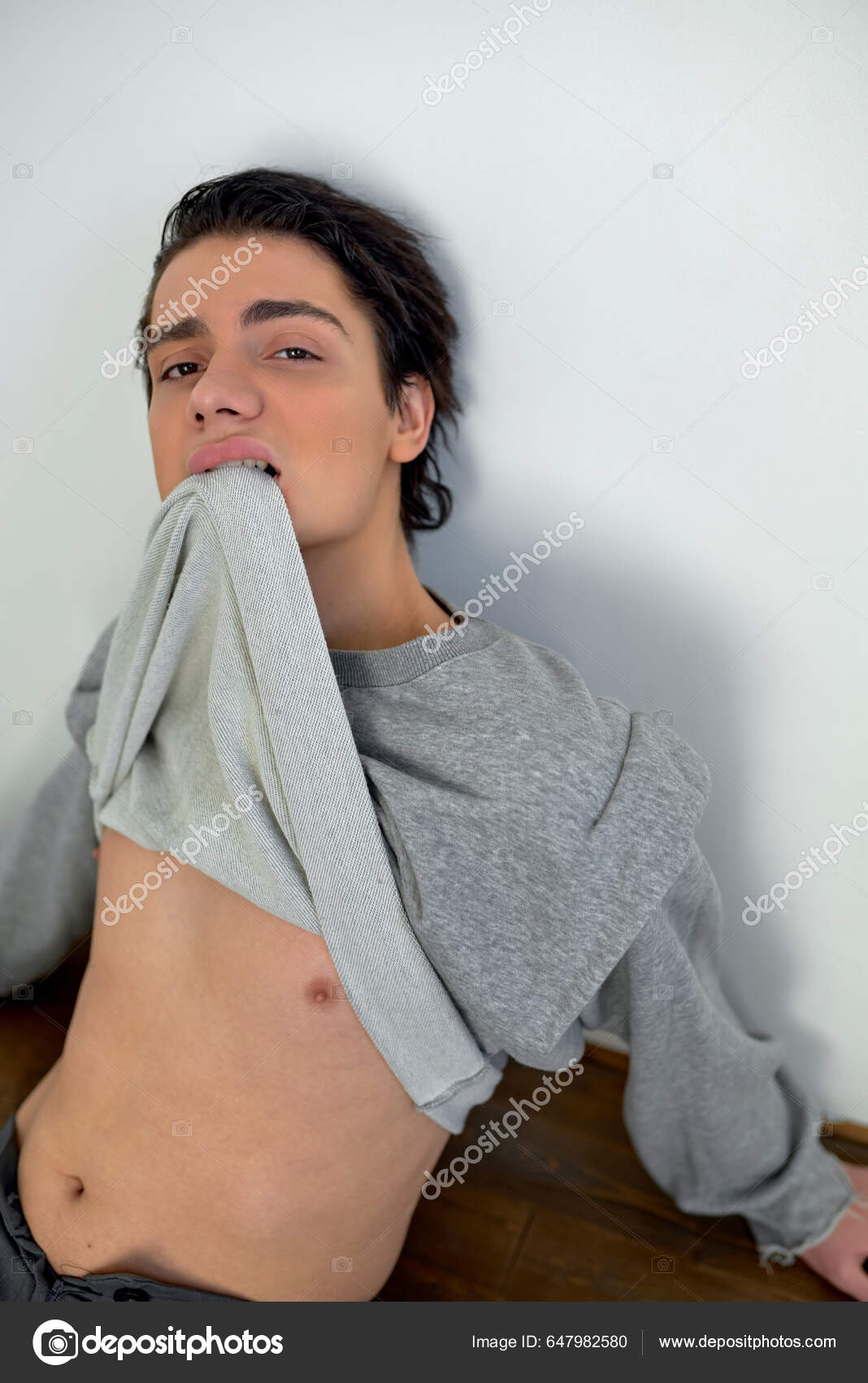 Sexy Young Man Showing His Belly Handsome Man Bites His — Stock Photo ©  romanchazov27 #647982580