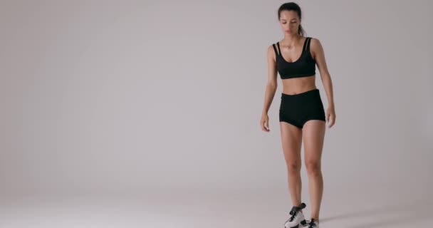 Slow Motion Young Woman Wearing Sports Bra Shorts Taking Resistance — Stock Video