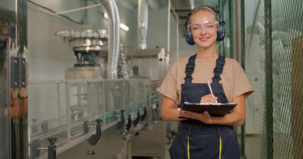 Smiling Happy Factory Worker Holding Folder Looking Camera Filling Checklist — Stock Video