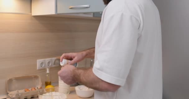 Young Man Adding Salt Dough Preparation Pie Cake Close Croppes — Stock Video
