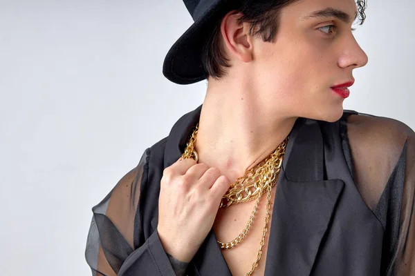 Close-up Portrait of guy grabbed the chain, wearing chic party clothes, isolated white backgorund, look at side. handsome caucasian male fashion model posing. beauty, people diversity concept