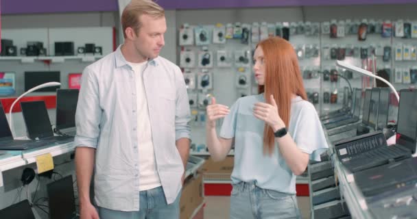 Handsome Man Redhead Woman Talking While Choosing Computer Male Looks — Stock Video