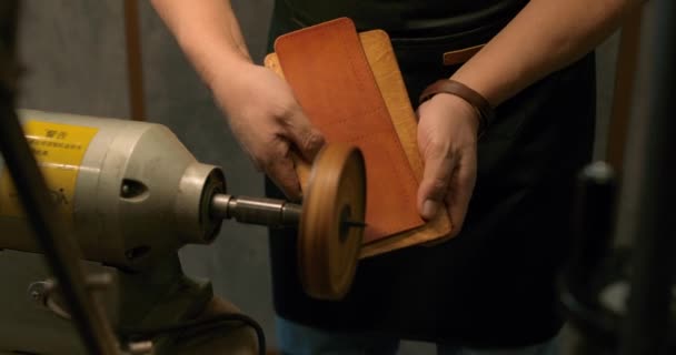 Talented Mature Craftsman Making Beautiful Smooth Finished Edge Leather Product — Stock Video