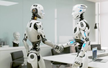 Robot ofiste bir başkasıyla el sıkışıyor.