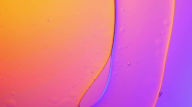 pastel color of oil drop floating on the water. The art of water surface for your products display and artwork design with copy space. holiday light background. holiday postcard background.