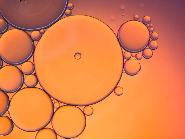 pastel artistic of oil drop floating on the water. Pastel color bubble for background. Abstract oil bubbles background. Macro shot. oil bubbles close up. Bright and unique oil drops.