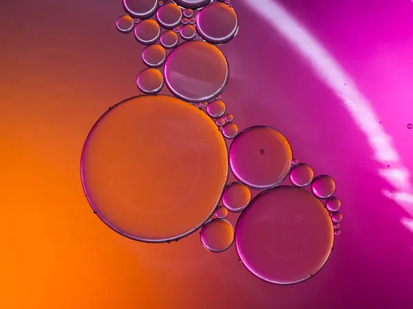 pastel artistic of oil drop floating on the water. Pastel color bubble for background. Abstract oil bubbles background. Macro shot. oil bubbles close up. Bright and unique oil drops.