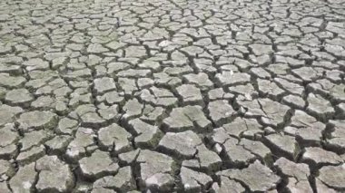 A drought is a period of drier than normal conditions. Dry cracked earth soil.Natural Drought.Cracked soil created texture.