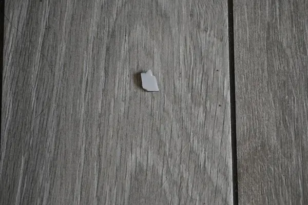 glass shards on the floor tiles