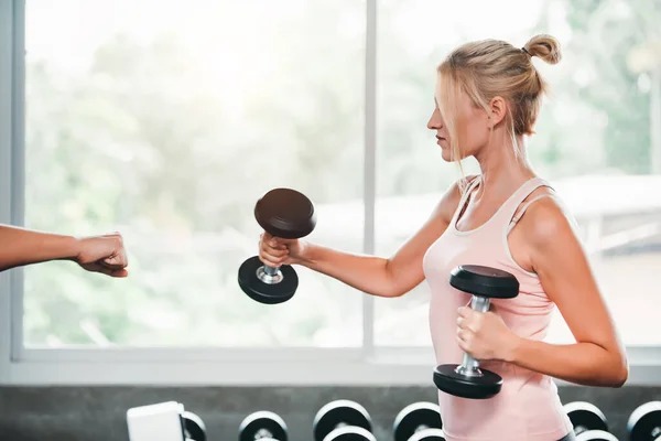 stock image Beautiful Caucasian Sport Woman Lifting Dumbbells and Workout Exercises in Gym - Lifestyle and Healthcare Concept