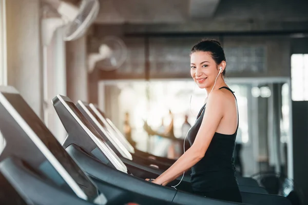 stock image Beautiful Caucasian Sport Woman Workout Exercising on Treadmill in Gym - Lifestyle and Healthcare Concept