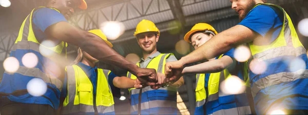 Panoramic Group of Diverse Warehouse Workers Join Hands Together To Making Team Spirit, Industrial Management and Teamwork for Optimal Efficiency.