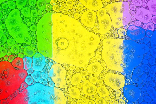 Geometrické Vícebarevné Pozadí Pokryté Malými Velkými Průhlednými Bublinami Tekutého Mýdla — Stock fotografie