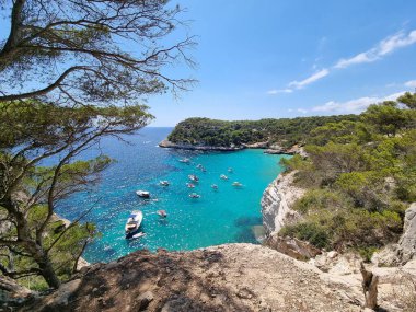 View of turquoise sea in beautiful bay Cala Mitjaneta in Menorca Spain