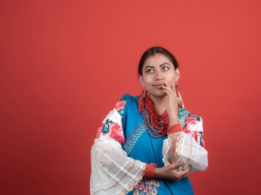 latin girl of kichwa origin looking incredulous with a red background clipart