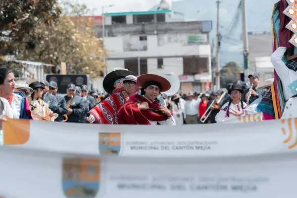stock image Machachi, Canton Mejia, Province of Pichincha, Ecuador -June 23, 2024: dancers in the parade with banners from the municipality of Mejia.