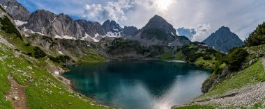 Panoramic mountain tour in Ehrwald via the Tajatorl to Drachensee, Coburger Hut and Seebensee in the Tiroler Zugspitz Arena clipart