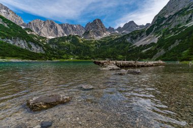 Panoramic mountain tour in Ehrwald via the Tajatorl to Drachensee, Coburger Hut and Seebensee in the Tiroler Zugspitz Arena clipart