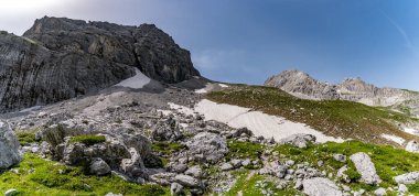 Mountain tour to the Vorderer Drachenkopf in the Mieminger mountains near Ehrwald in the Tiroler Zugspitz Arena clipart