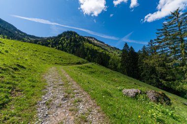 Mountain tour over the Brunnenauscharte to the Hochgrat on the Nagelfluhkette in the Allgau clipart