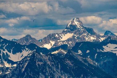 Mountain tour over the Brunnenauscharte to the Hochgrat on the Nagelfluhkette in the Allgau clipart