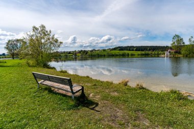 Beautiful hike along the Rottachsee lake with ravine path to the Burgkranzegg ruins in the Allgau region clipart