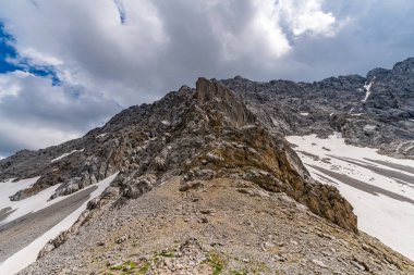 Panoramic mountain tour in Ehrwald via the Tajatorl to Drachensee, Coburger Hut and Seebensee in the Tiroler Zugspitz Arena clipart