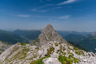 Mountain tour to the Vorderer Drachenkopf in the Mieminger mountains near Ehrwald in the Tiroler Zugspitz Arena clipart